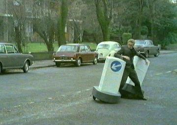 Two keep-left signs attack a vicar